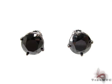 Round black diamond stud earrings in sleek white metal prongs, classic men’s style