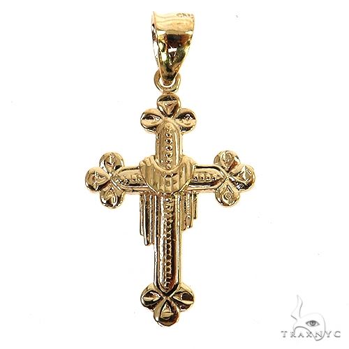 10K yellow gold crucifix pendant with detailed floral tips on cross ends