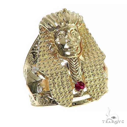 10K yellow gold men's ring featuring an Egyptian pharaoh head design with red gemstone accents