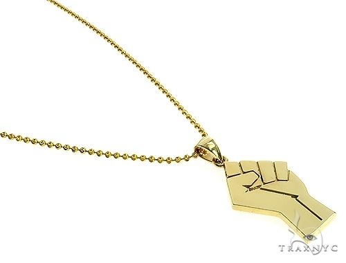 10K yellow gold pendant with a raised power fist design on a thin chain