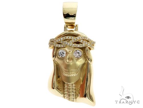 10K yellow gold skull pendant with diamond eyes and prong bezel crown of thorns detailing