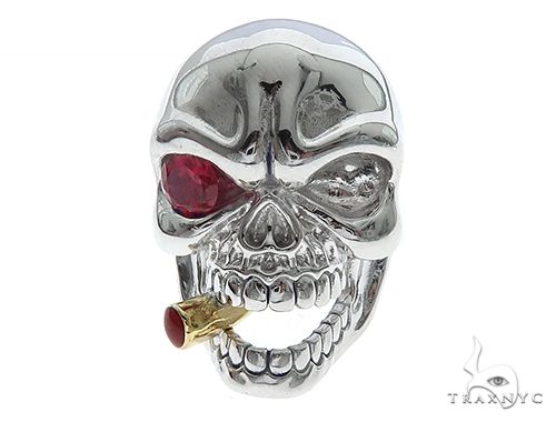 10K white gold skull ring with red gemstone eyes and cigar detail on teeth
