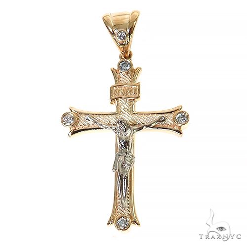 14K two-tone gold cross pendant with diamond accents and detailed Jesus figure