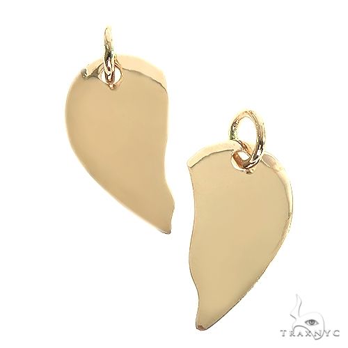 14K gold broken heart pendant, split-heart silhouette, polished finish, front view