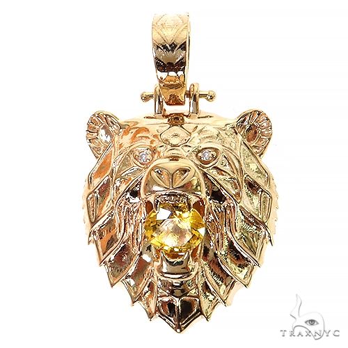 14K rose gold grizzly bear pendant with yellow gemstone eye detail and textured fur design