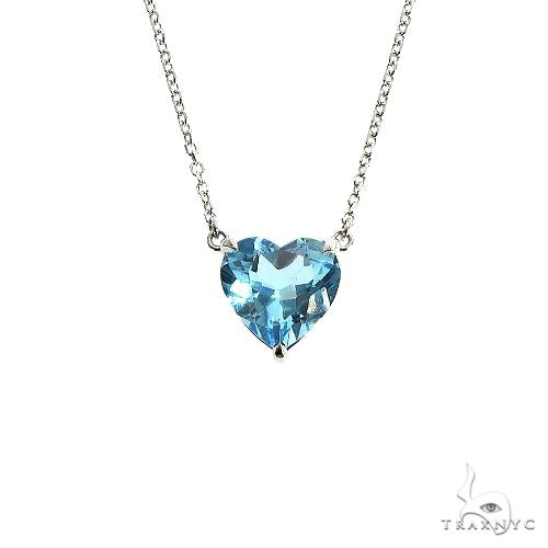 Heart-shaped blue topaz pendant necklace in 14k yellow gold – front view of stone and setting
