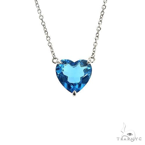 Heart-cut Swiss blue topaz necklace in 14k yellow gold — front view of stone and setting