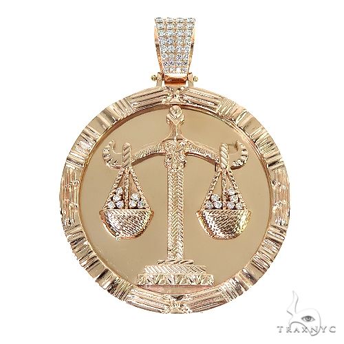 14k gold Libra scales pendant — front view showing relief detailing on polished yellow gold
