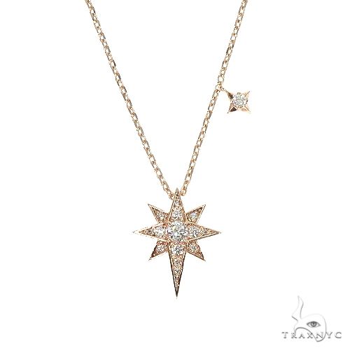 14K rose gold necklace with a diamond-studded eight-point polar star pendant