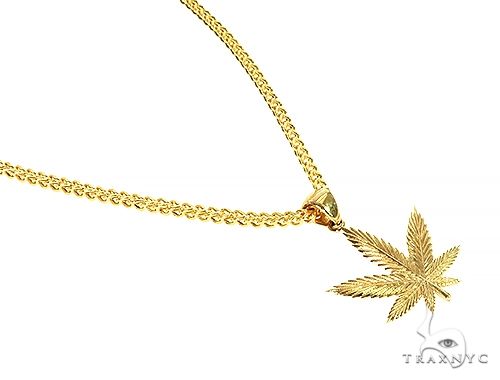 14K yellow gold marijuana leaf pendant on 10K Franco chain necklace