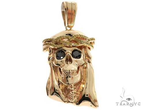 14K yellow gold skull pendant with black diamond eyes and crown of thorns design