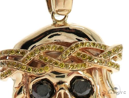14K rose gold skull pendant with prong bezel diamonds and intricate crown design