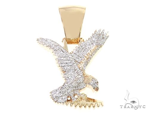 14K yellow gold eagle pendant with micro pave diamonds in detailed spread-wing design