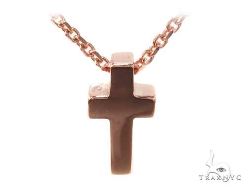 14K rose gold necklace with a polished cross pendant on a delicate chain