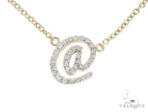 Diamond at sign necklace in 14K yellow gold – front view of symbol-shaped pendant with pavé diamond setting