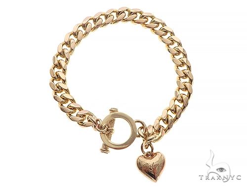 14k yellow gold Cuban link bracelet with heart charm and toggle clasp, front view