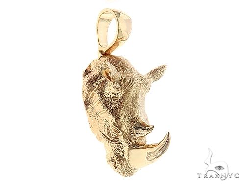 14K yellow gold custom rhino pendant – three-quarter view showing sculpted metal detail