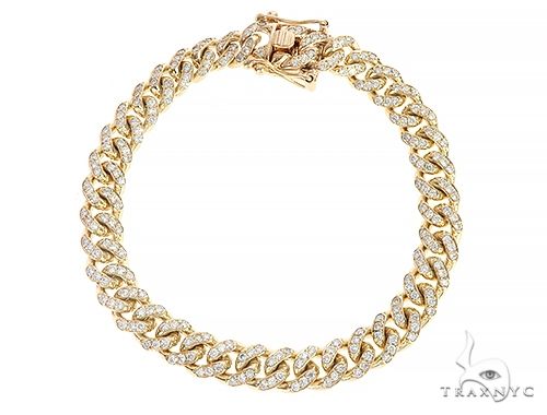 Men's Miami Cuban bracelet in 14k yellow gold with diamond-set links, front-facing flat lay