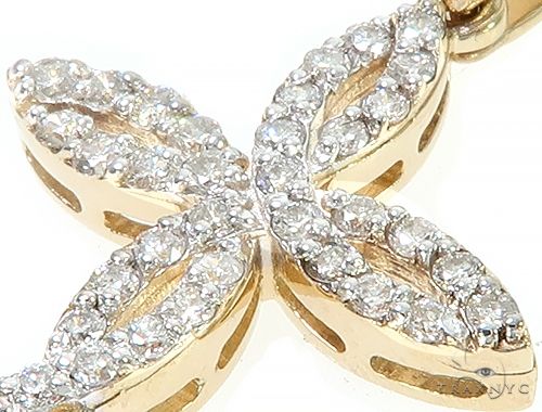 14K yellow gold cross pendant with twisted design and sparkling diamond accents