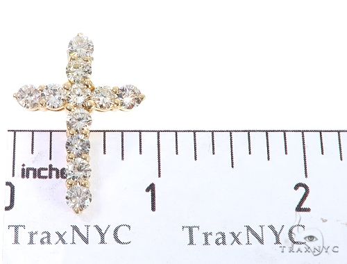 14k yellow gold cross pendant with round diamonds, measuring just under 1 inch tall