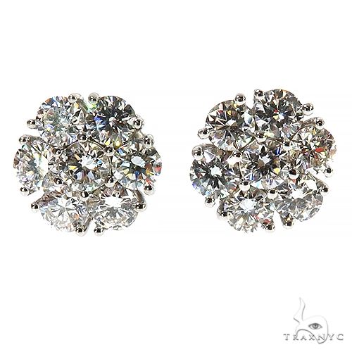 White gold flower cluster earrings with sparkling round diamonds, 15-point total weight