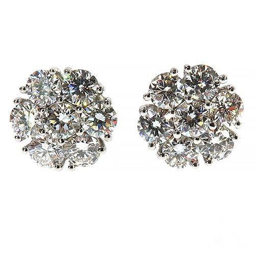 White gold floral cluster earrings with sparkling round diamonds totaling 1.5 carats