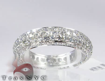 Men's white gold diamond wedding band with three rows of small round diamonds
