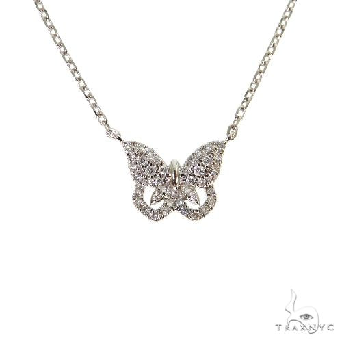 18K white gold butterfly necklace with baguette and round diamonds on delicate chain