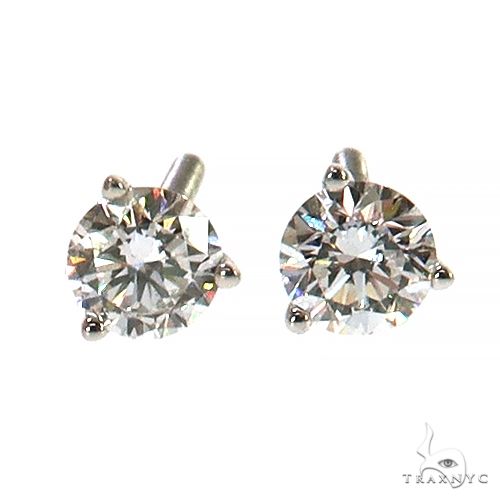 White gold diamond stud earrings with round 0.25 ct brilliant cut stones in prong setting