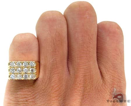 Yellow gold men’s pinky ring with 12 round sparkling diamonds in a bold rectangular setting
