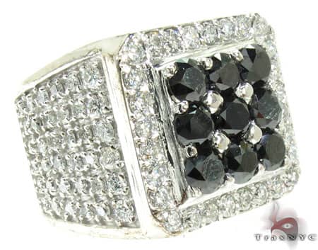 Men's white gold ring with square black diamond cluster framed by white diamonds