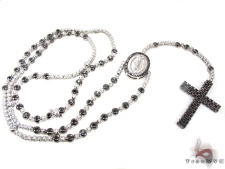White gold rosary with black diamonds and a detailed oval centerpiece pendant