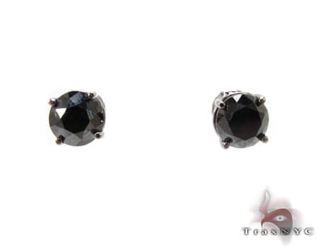 Black diamond stud earrings set in white metal prong settings with round cut stones