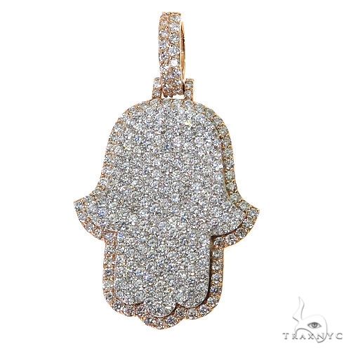 Two-tone diamond-studded Hamsa pendant with sparkling pave setting and rose gold edges