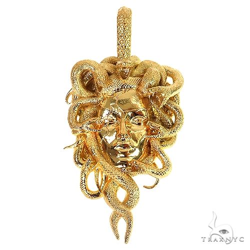 22K gold Medusa pendant – detailed sculpted face motif in deep yellow gold, front view