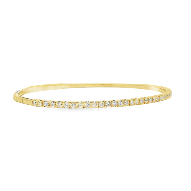 Yellow gold flexible bangle bracelet with a row of sparkling round diamonds