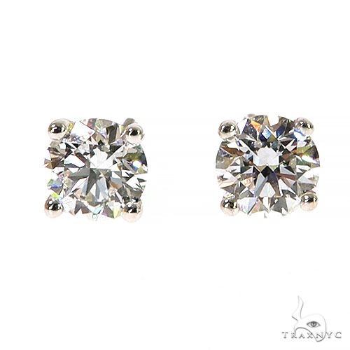 Round brilliant cut diamond stud earrings in white metal setting, 0.40 ct each