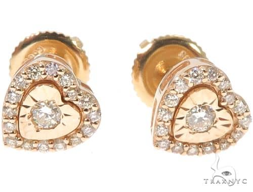 14K yellow gold heart-shaped stud earrings with center diamond and surrounding diamonds