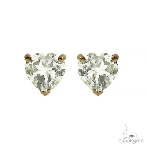 Heart shape white topaz earrings in 14k yellow gold — front view showing faceted stone and gold setting