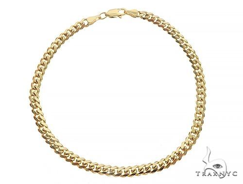 Solid Miami Cuban link bracelet in 10k yellow gold, 3.3mm wide, 8-inch length, close-up of link detail