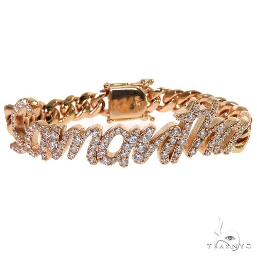 Custom diamond name bracelet on Miami Cuban curb links in 14k yellow gold – prong-set stones, angled top view
