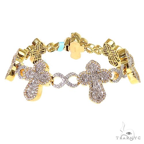 baguette diamond cross bracelet in gold – fancy link design with channel-set baguette stones and cross centerpiece