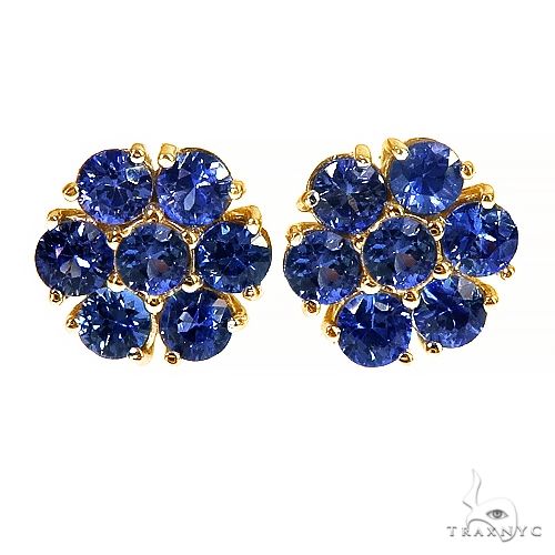 Small flower cluster earrings set with green sapphire stones — front view showing petal motif detail