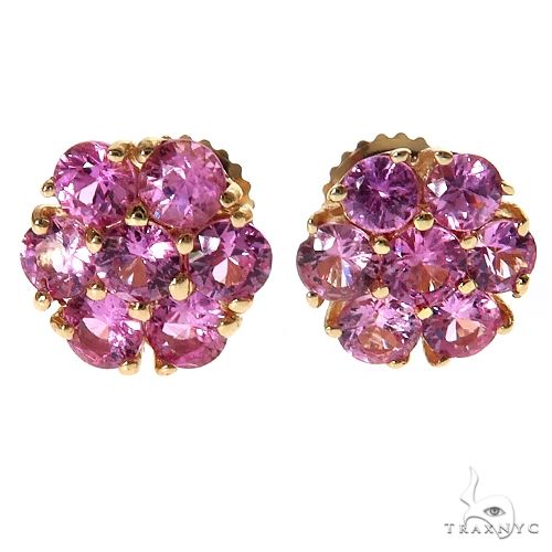 Large cherry blossom cluster earrings with green sapphire stones arranged in a floral petal pattern