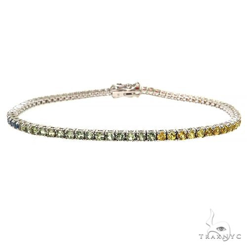 White gold tennis bracelet with 2.7mm rainbow sapphire gemstones in a 5-point setting