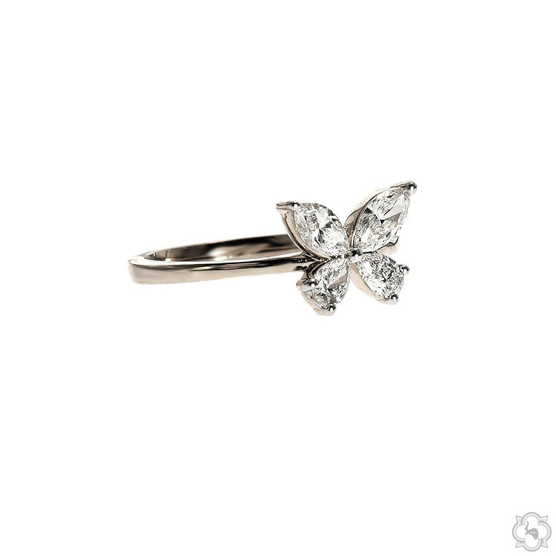White gold butterfly ring with four marquise-cut diamonds forming butterfly wings