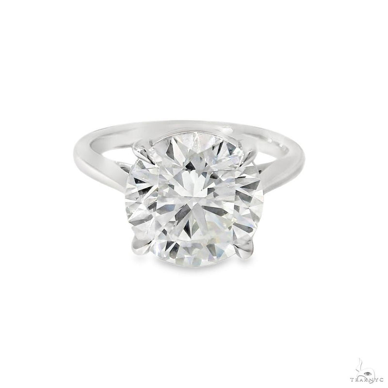 Round brilliant solitaire diamond engagement ring on polished band – face-up center stone view