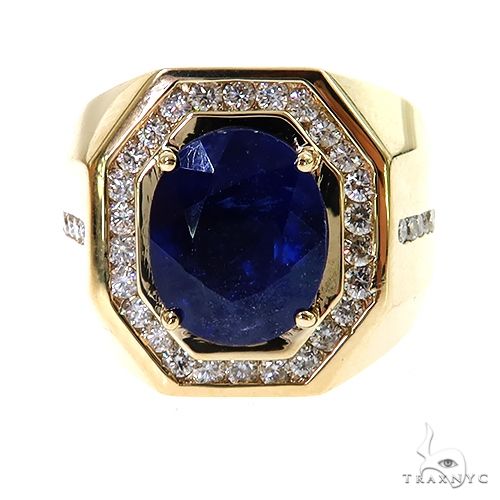 Yellow gold men's ring with large oval sapphire and halo of small diamonds