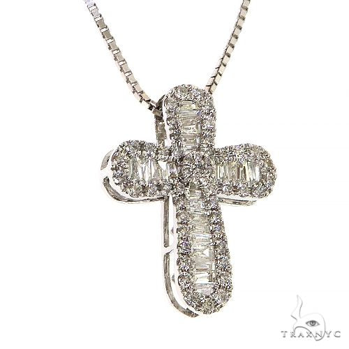 White gold cross pendant set with baguette and round diamonds on a box chain necklace