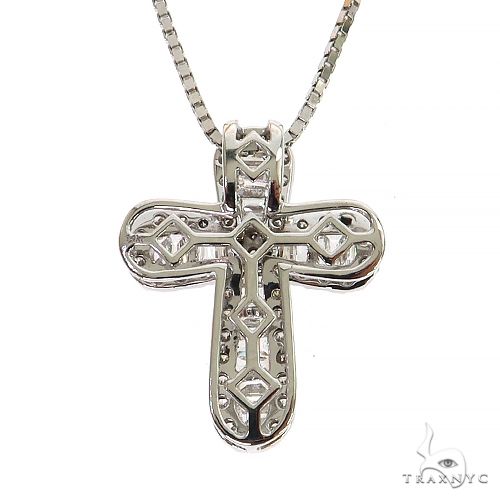 White gold baguette diamond cross pendant with intricate openwork design on box chain